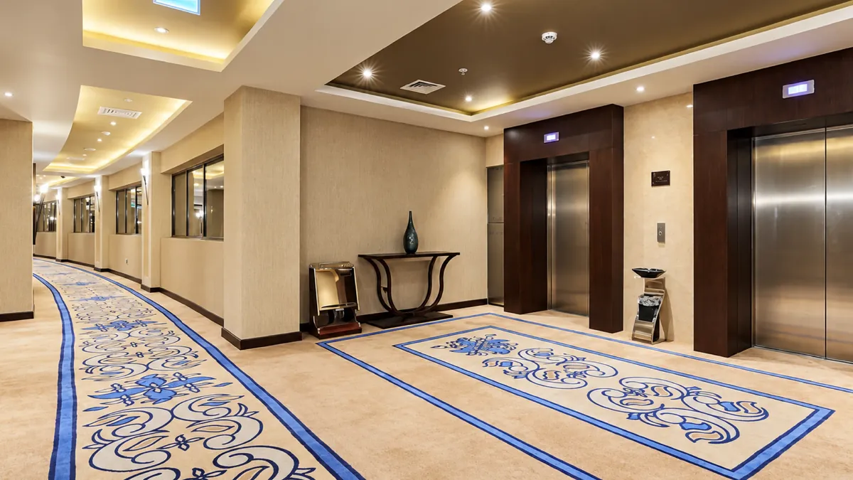 Grand Millennium Jazan — lift lobby after the ASAS fit-out